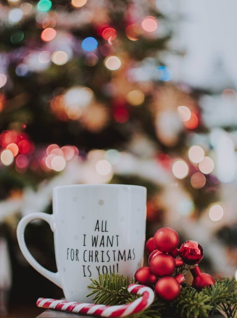 a mug with printed christmas text