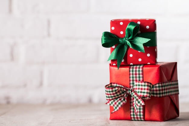 two red gift boxes with different ribbon designs